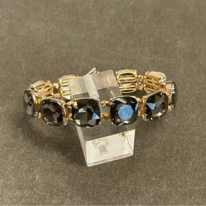 gold-tone stretch band bracelet with large square-cut dark rhinestones